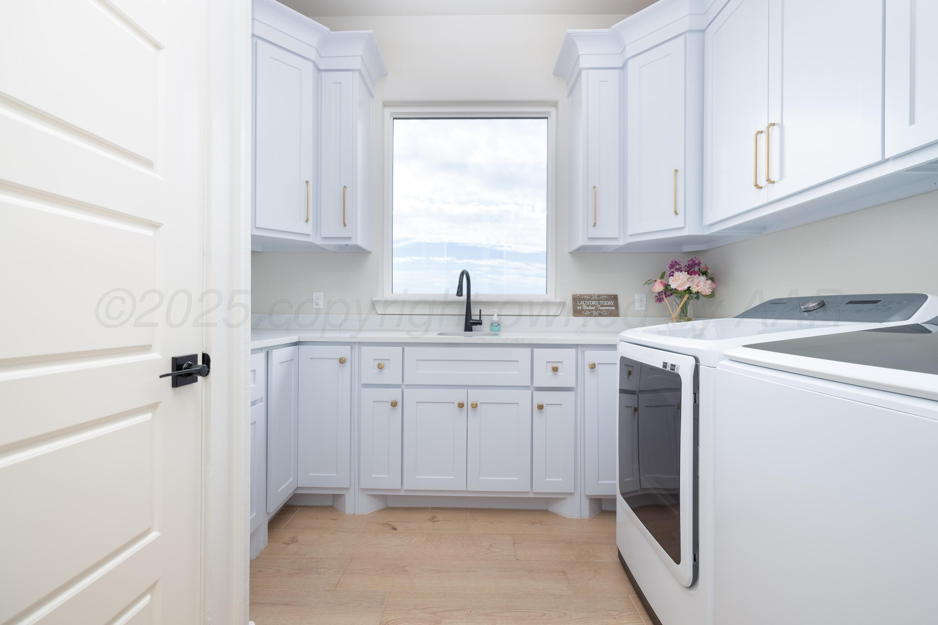 9507 Meadow Ridge Amarillo, TX 79118 - Photo 36 of 56 a kitchen with sink cabinets and window