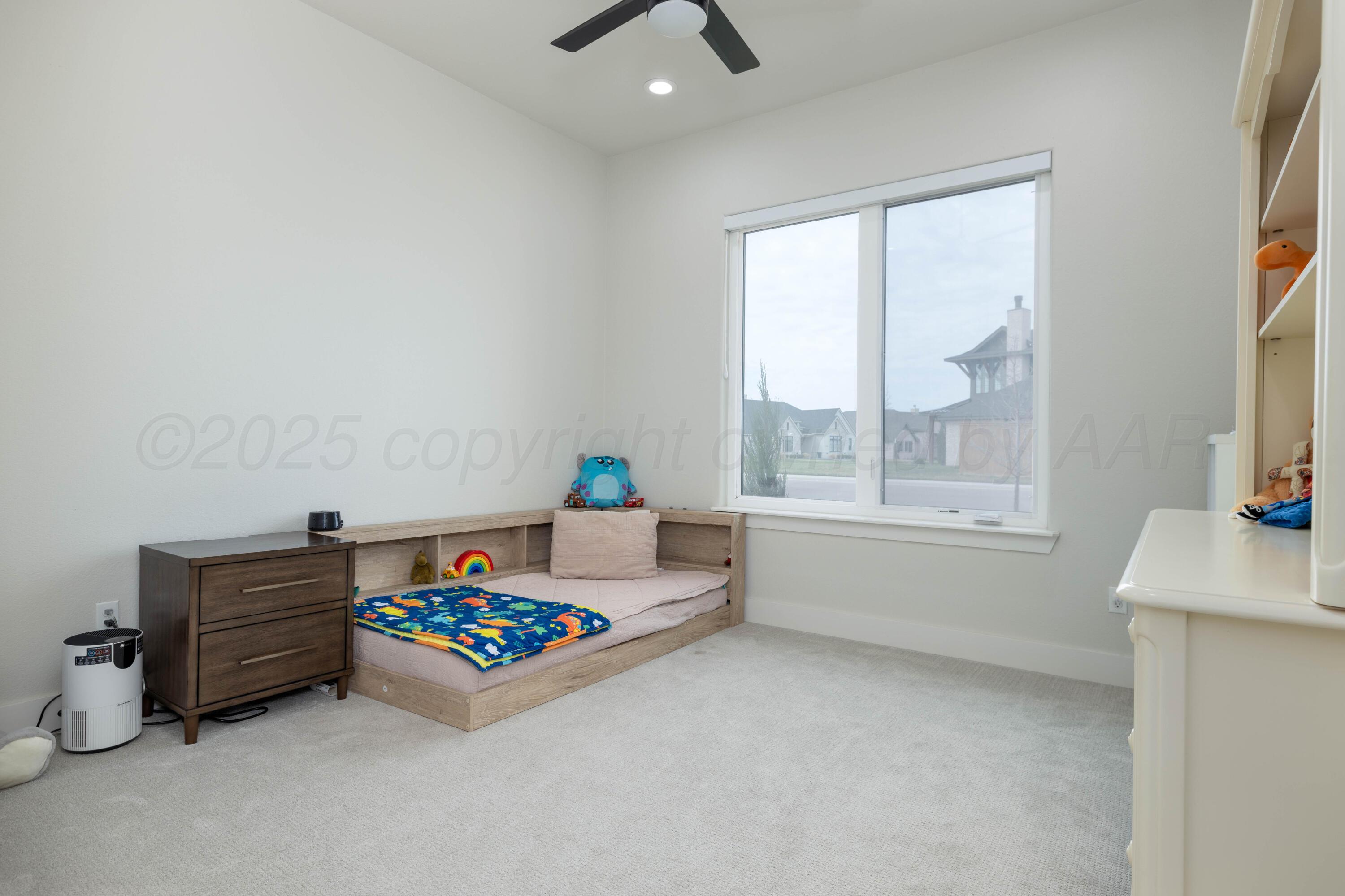 9507 Meadow Ridge Amarillo, TX 79118 - Photo 39 of 56 a living room with furniture and a window