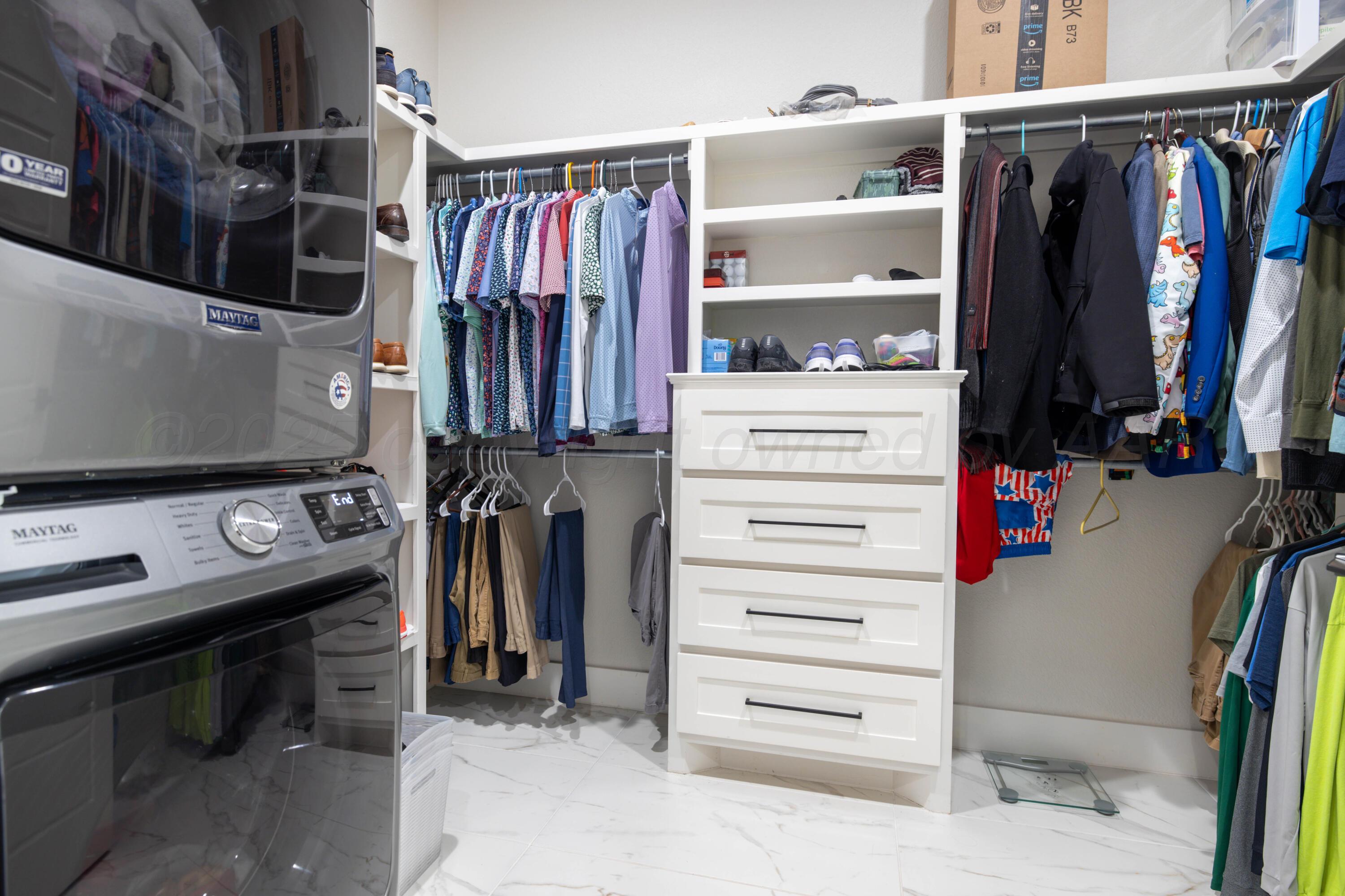 9507 Meadow Ridge Amarillo, TX 79118 - Photo 44 of 56 a view of walk in closet with clothes and shoes