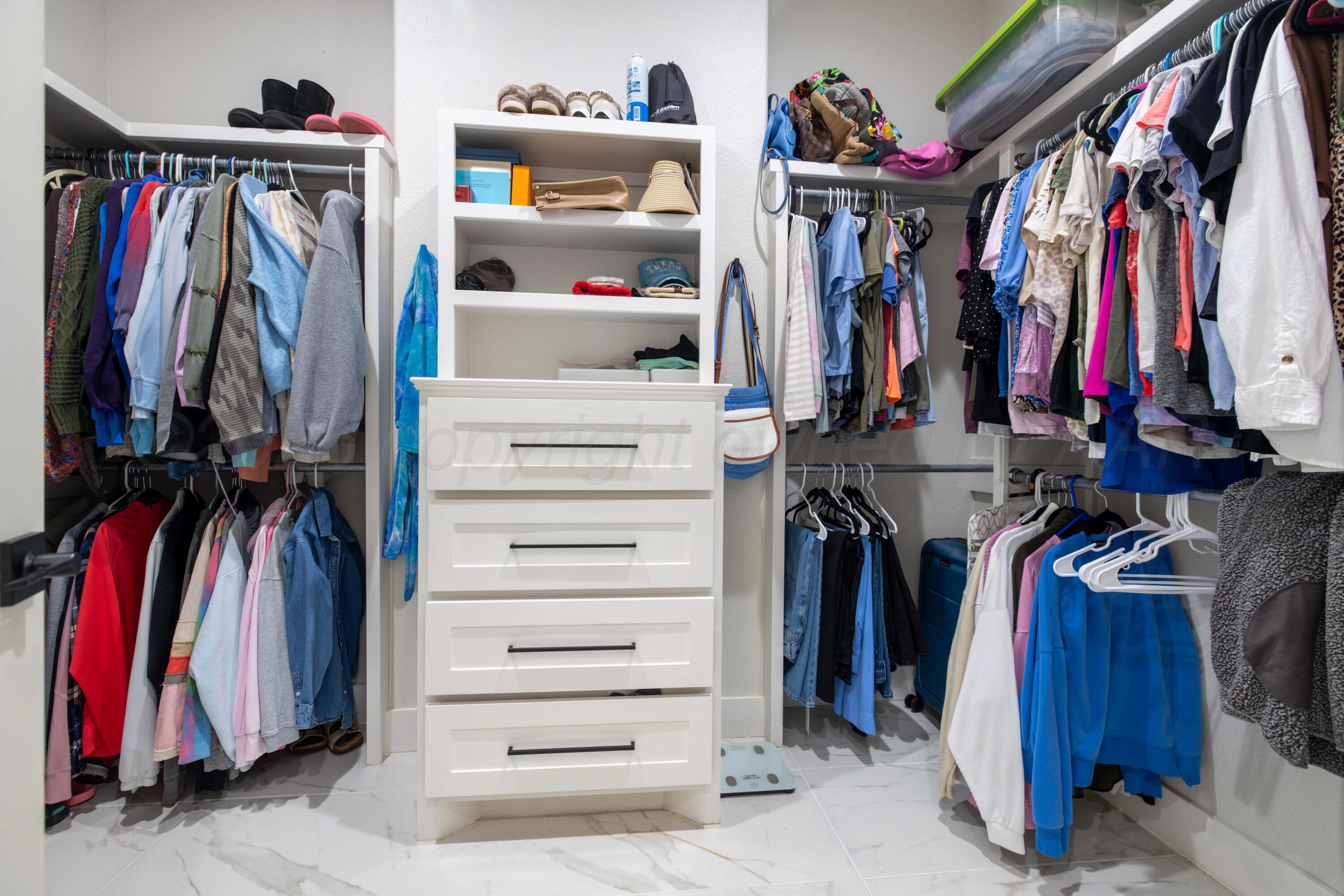 9507 Meadow Ridge Amarillo, TX 79118 - Photo 45 of 56 a view of walk in closet with clothes and shoes