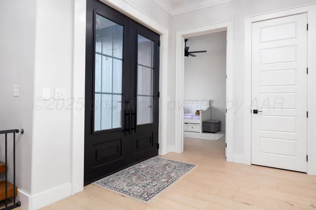 a view of entryway and hall with wooden floor