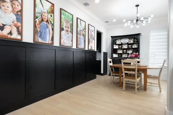 a view of a livingroom with workspace and a window