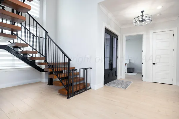 a view of entryway with wooden floor