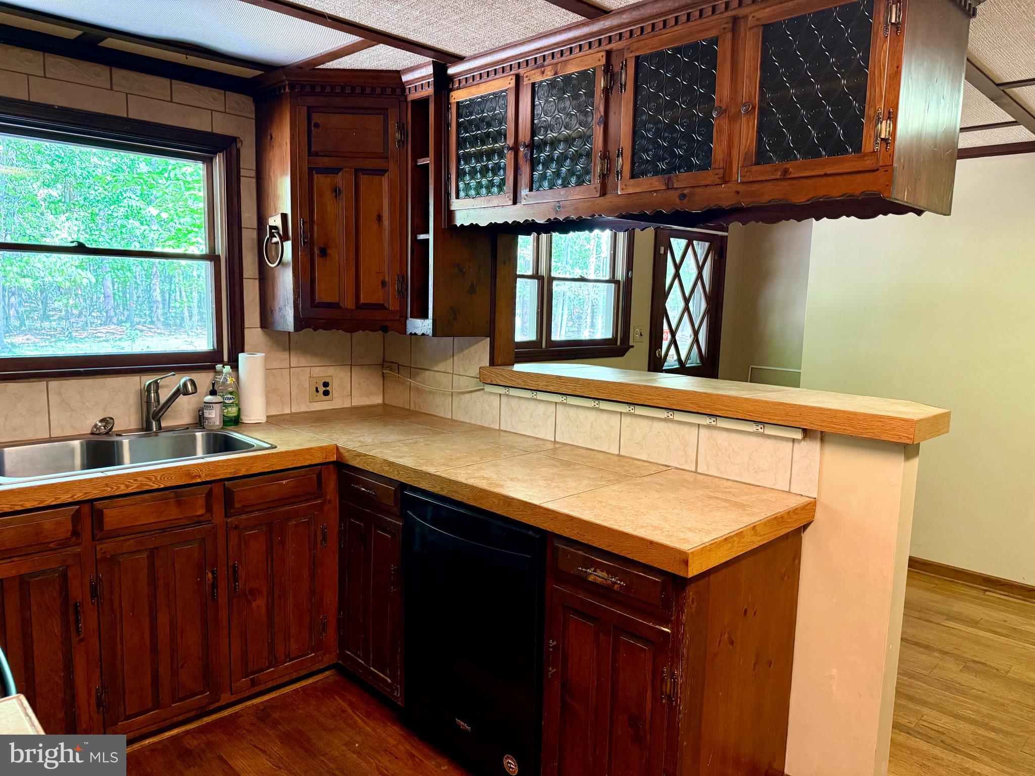 229 Oakshade Road Tabernacle, NJ 08088 - Photo 33 of 57 a kitchen with stainless steel appliances granite countertop a sink and wooden cabinets