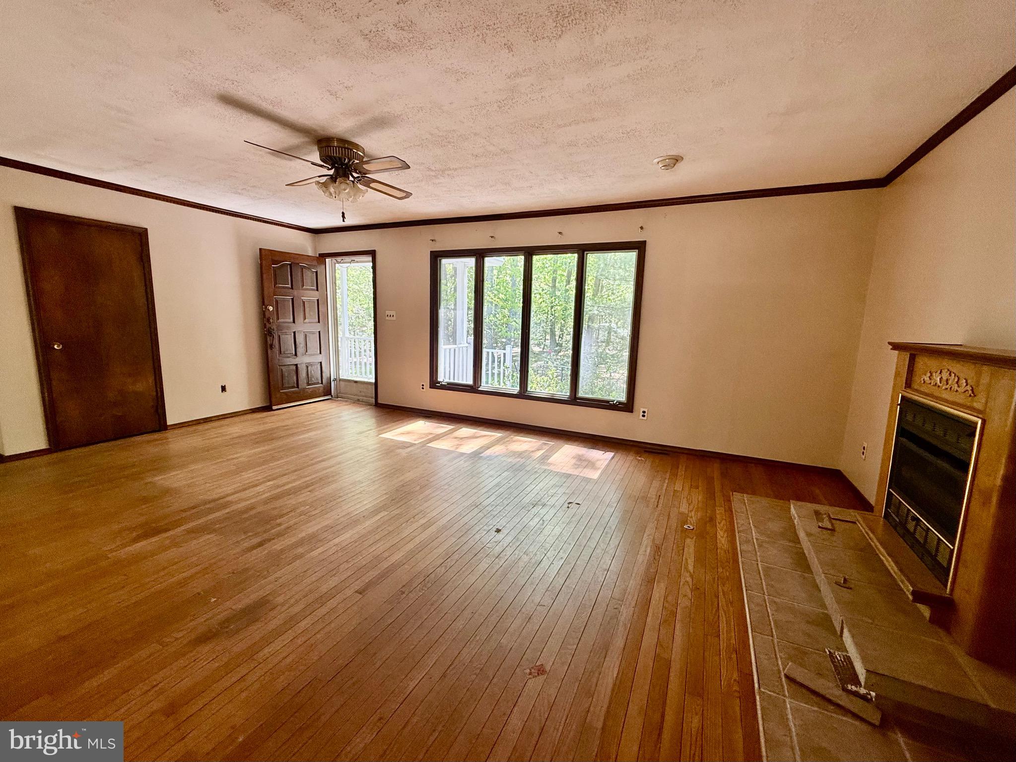 229 Oakshade Road Tabernacle, NJ 08088 - Photo 37 of 57 a view of an empty room with wooden floor and a window