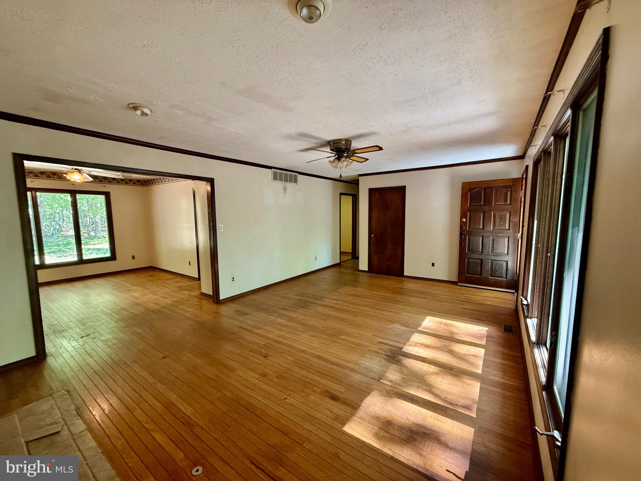 229 Oakshade Road Tabernacle, NJ 08088 - Photo 38 of 57 a view of an empty room with window and wooden floor
