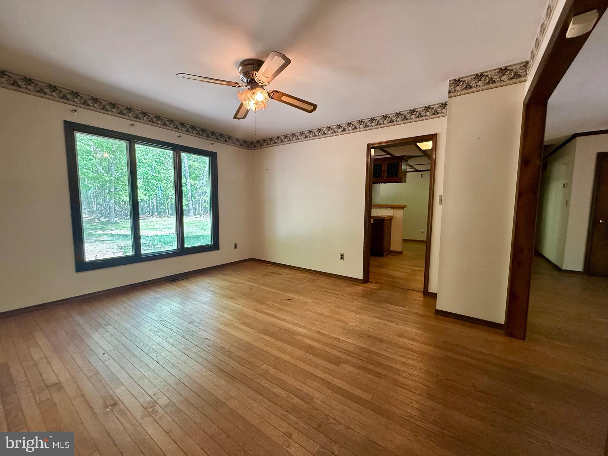 229 Oakshade Road Tabernacle, NJ 08088 - Photo 39 of 57 a view of an empty room with wooden floor and a window