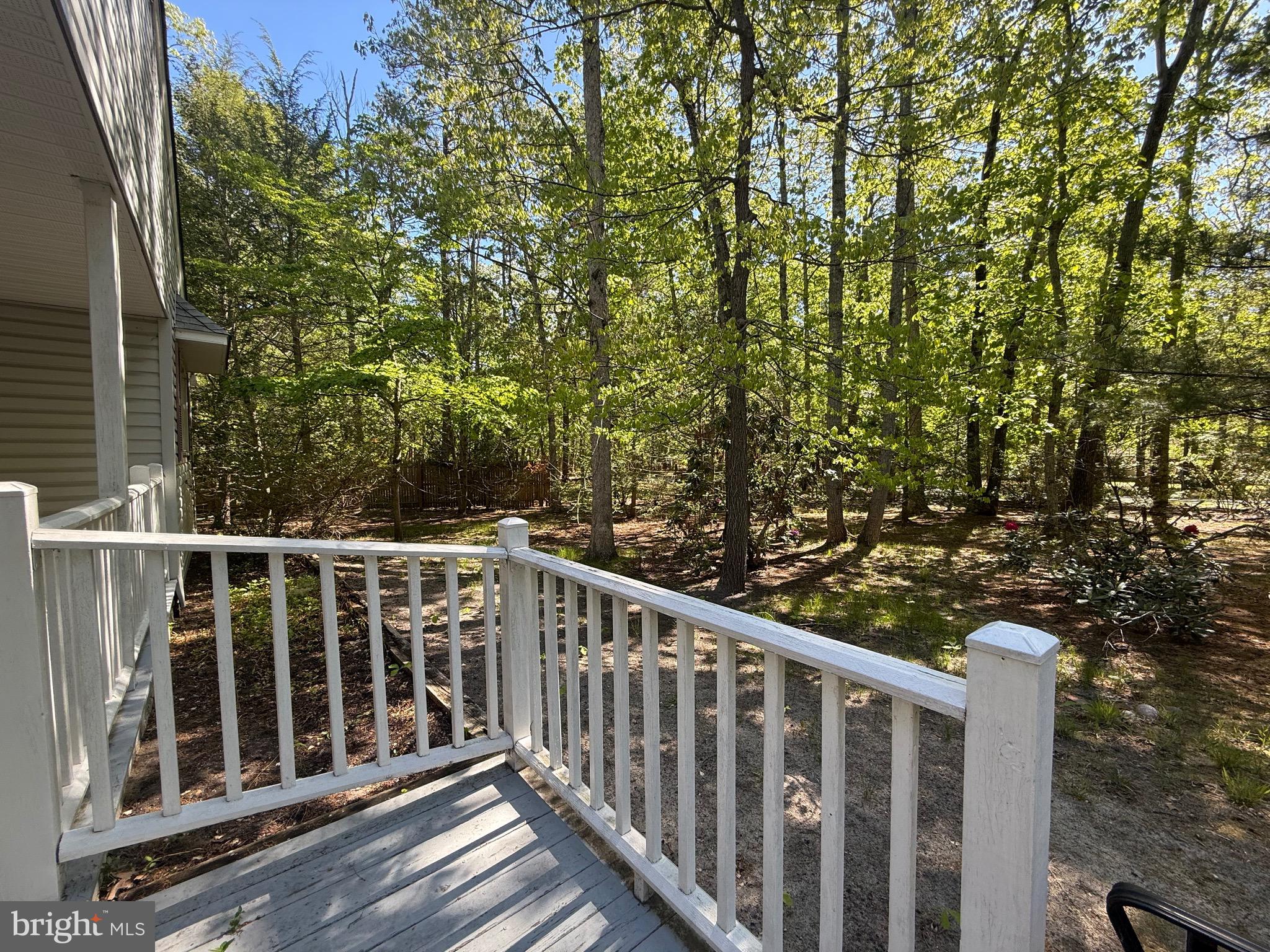 229 Oakshade Road Tabernacle, NJ 08088 - Photo 6 of 57 a view of a balcony with wooden floor and fence