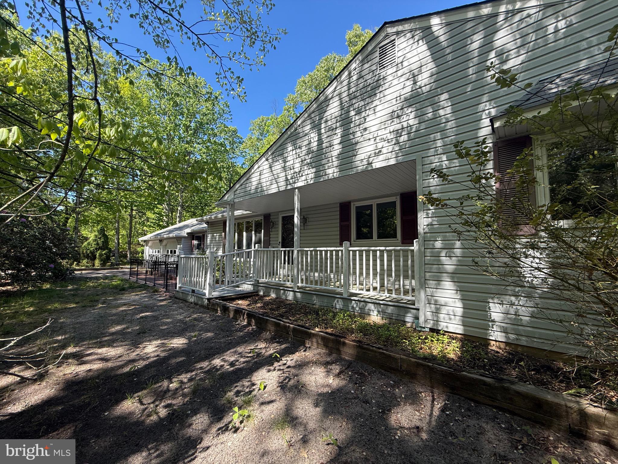 229 Oakshade Road Tabernacle, NJ 08088 - Photo 7 of 57 a front view of a house with a yard