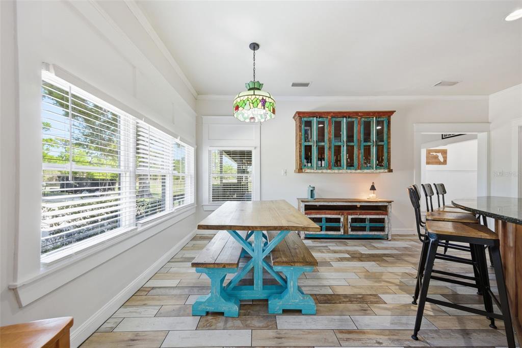 3752 Old Keystone Road Tarpon Springs, FL 34688 - Photo 14 of 71 a living room with furniture a dining table and a window
