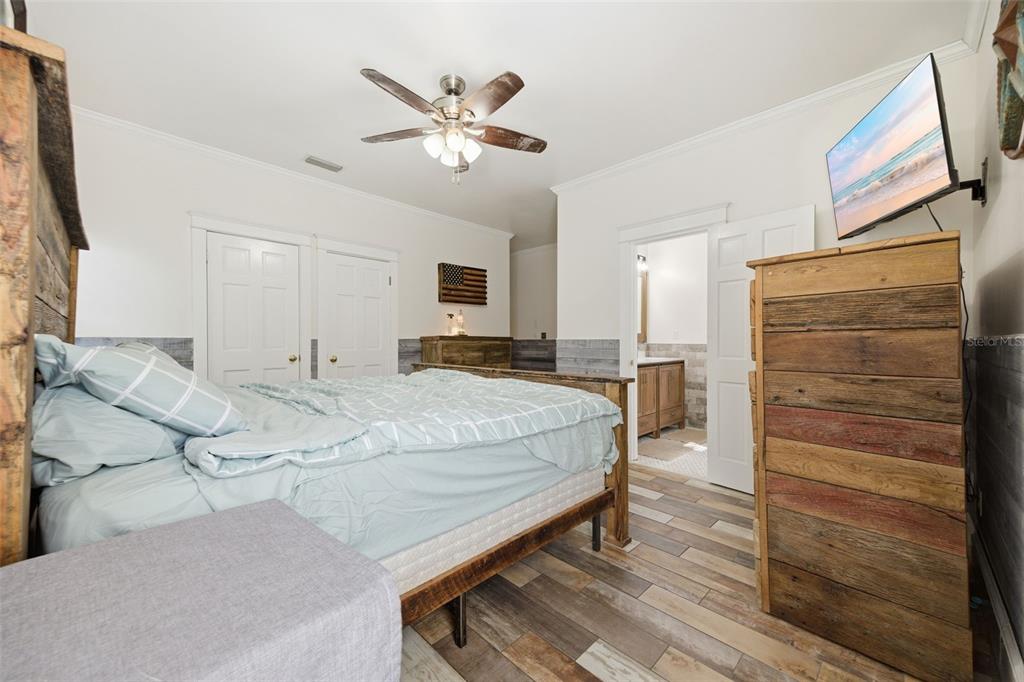 3752 Old Keystone Road Tarpon Springs, FL 34688 - Photo 20 of 71 a spacious bedroom with a bed and cabinet