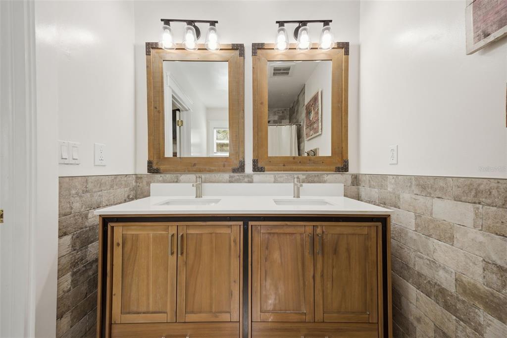 3752 Old Keystone Road Tarpon Springs, FL 34688 - Photo 23 of 71 a bathroom with a sink and a mirror