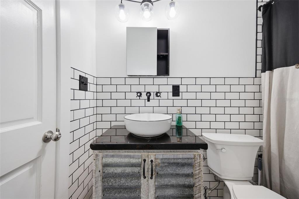 3752 Old Keystone Road Tarpon Springs, FL 34688 - Photo 29 of 71 a bathroom with a toilet and a sink