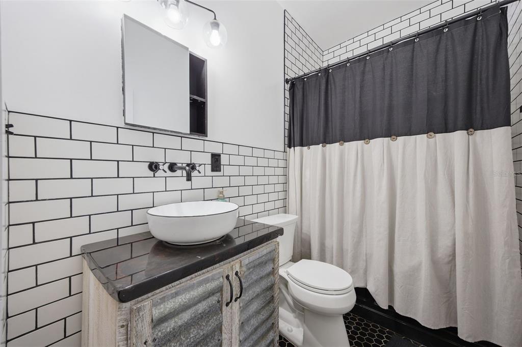 3752 Old Keystone Road Tarpon Springs, FL 34688 - Photo 30 of 71 a bathroom with a sink and a toilet