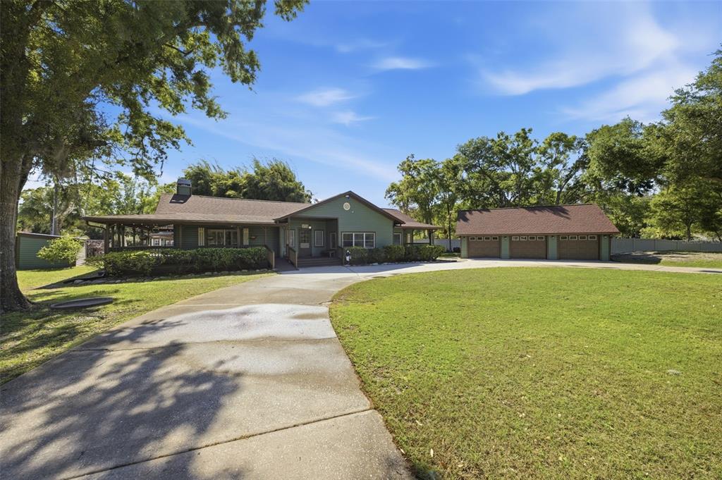 3752 Old Keystone Road Tarpon Springs, FL 34688 - Photo 3 of 71 a front view of house with yard and green space