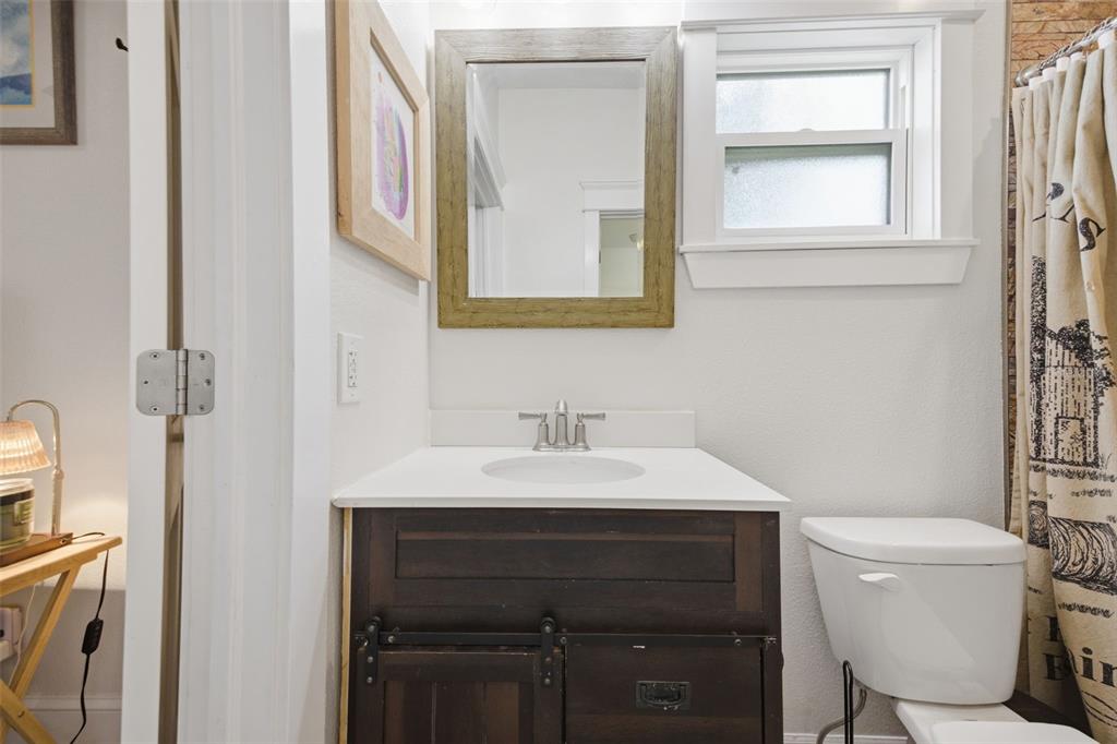 3752 Old Keystone Road Tarpon Springs, FL 34688 - Photo 33 of 71 a bathroom with a toilet sink and mirror