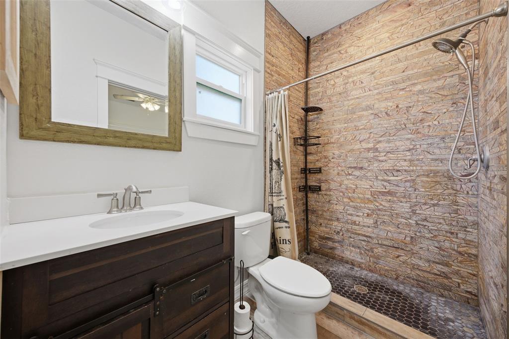 3752 Old Keystone Road Tarpon Springs, FL 34688 - Photo 34 of 71 a bathroom with a sink a toilet and shower