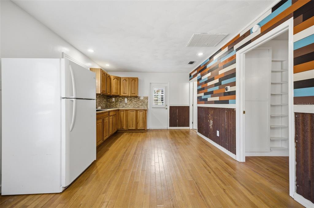 3752 Old Keystone Road Tarpon Springs, FL 34688 - Photo 47 of 71 a kitchen with wooden floors and appliances