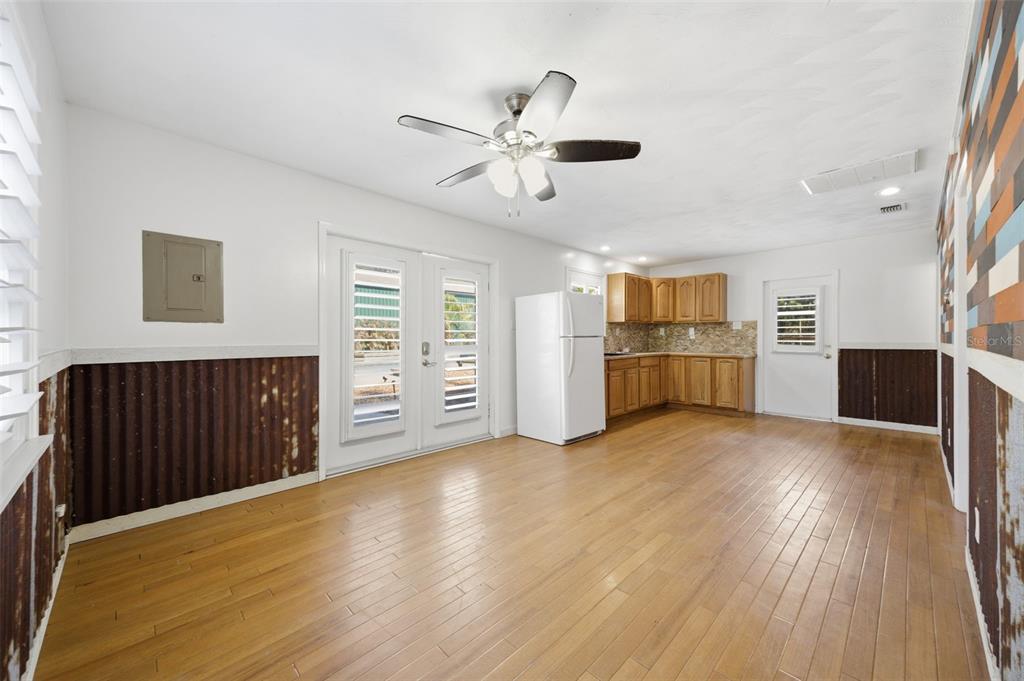 3752 Old Keystone Road Tarpon Springs, FL 34688 - Photo 49 of 71 a view of a livingroom with a ceiling fan window and wooden floor