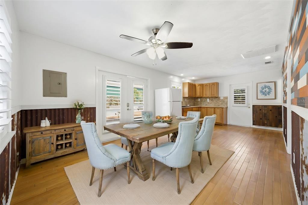 3752 Old Keystone Road Tarpon Springs, FL 34688 - Photo 50 of 71 a dining room with furniture a window and wooden floor