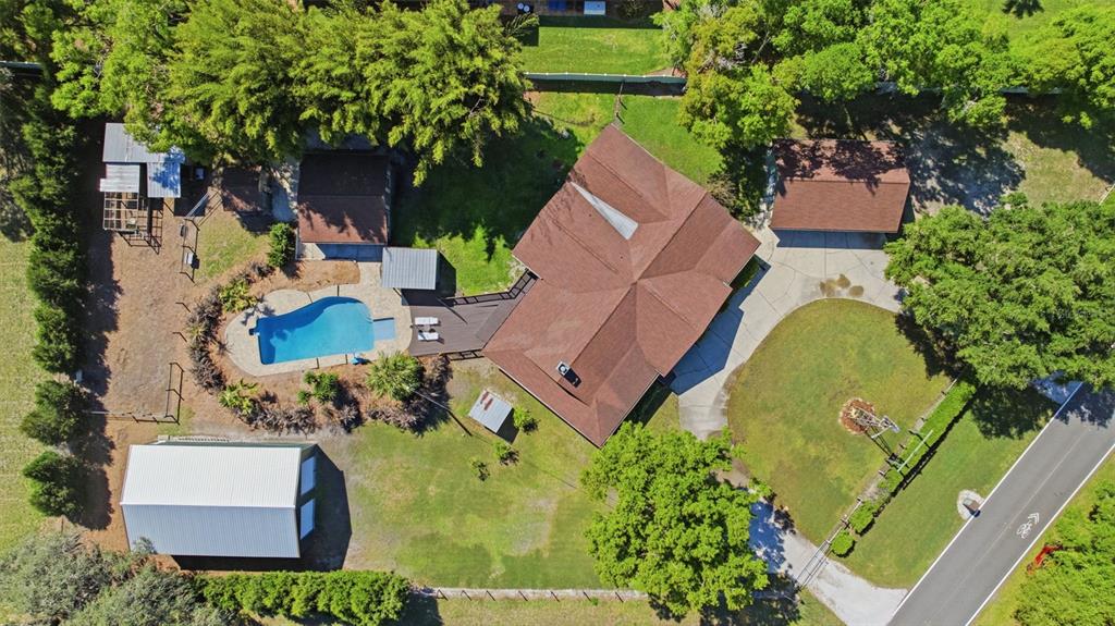 3752 Old Keystone Road Tarpon Springs, FL 34688 - Photo 68 of 71 an aerial view of a house with swimming pool and garden
