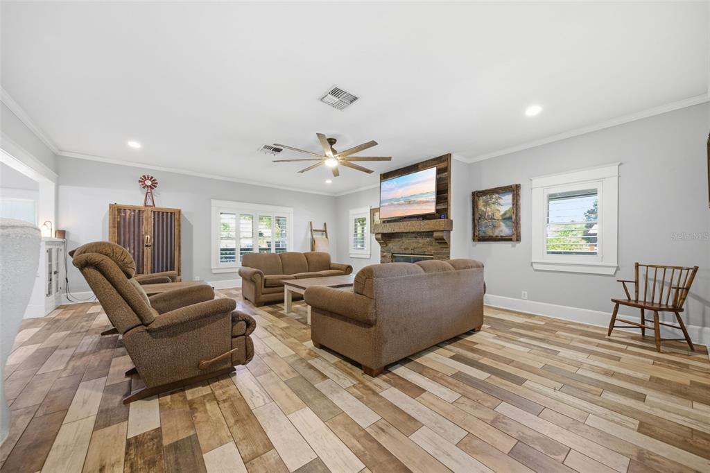 3752 Old Keystone Road Tarpon Springs, FL 34688 - Photo 10 of 71 a living room with furniture and a wooden floor