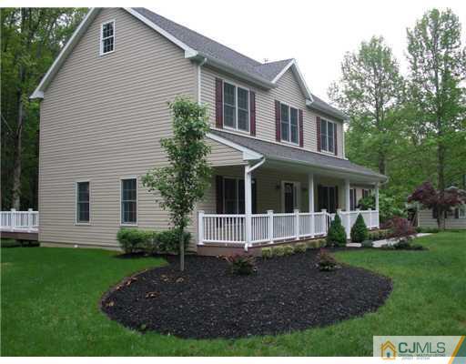 39 Haypress Road Dayton, NJ 08810 - Photo 1 of 11 a front view of a house with a yard and porch
