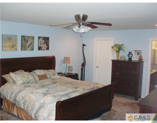 39 Haypress Road Dayton, NJ 08810 - Photo 7 of 11 a bedroom with a bed and a dresser