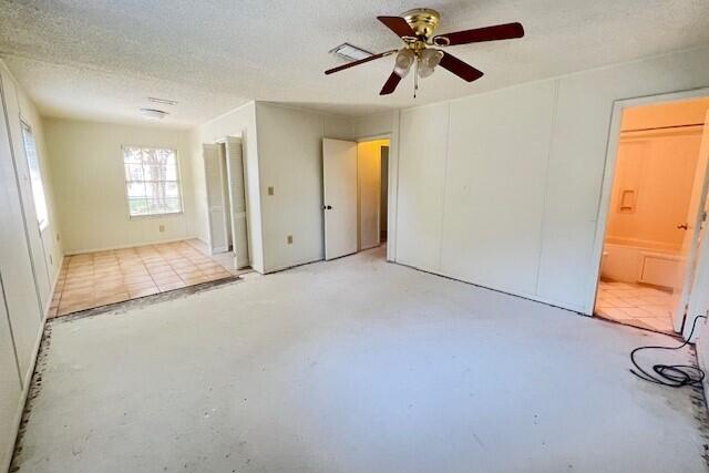 406 Spring Lane Destin, FL 32541 - Photo 20 of 25 an empty room with windows and a ceiling fan