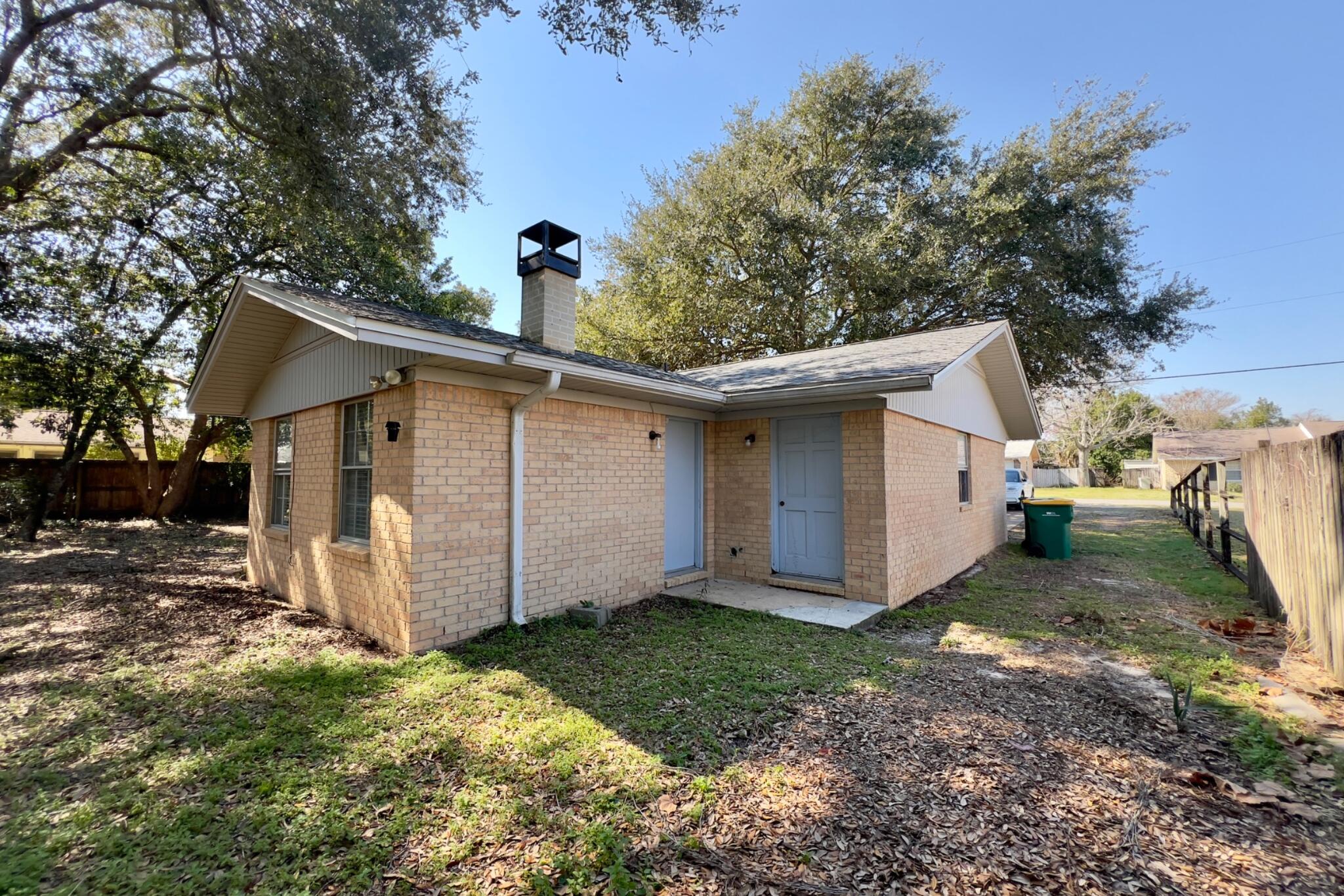 406 Spring Lane Destin, FL 32541 - Photo 9 of 25 a view of a house with a yard
