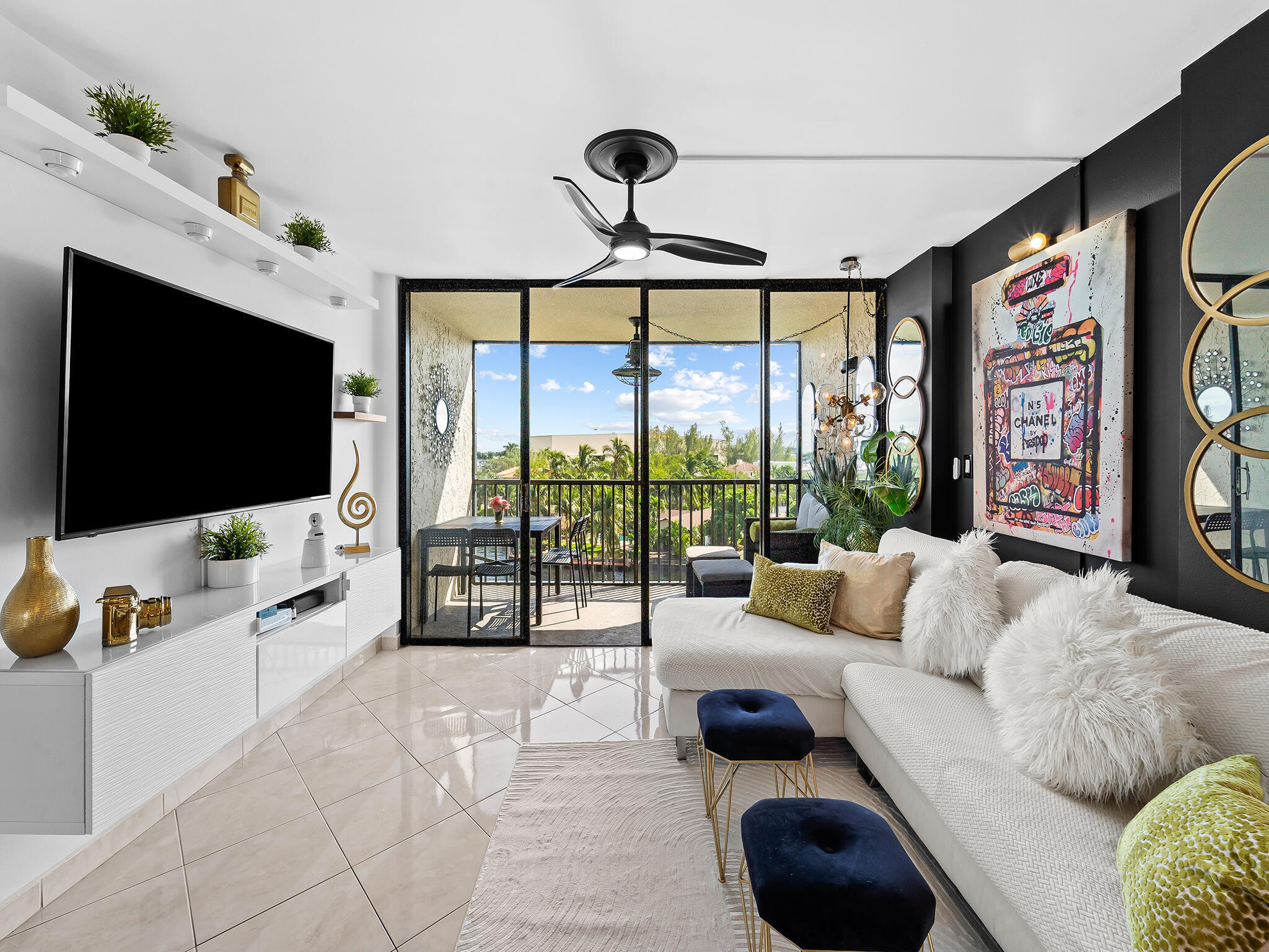 a living room with furniture and a flat screen tv