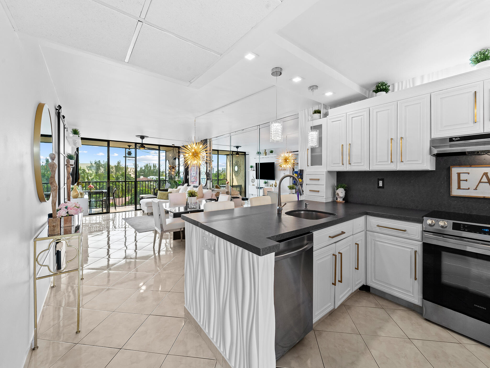 13 Royal Palm Way, Unit 5030 Boca Raton, FL 33432 - Photo 15 of 15 a kitchen with appliances a sink and cabinets