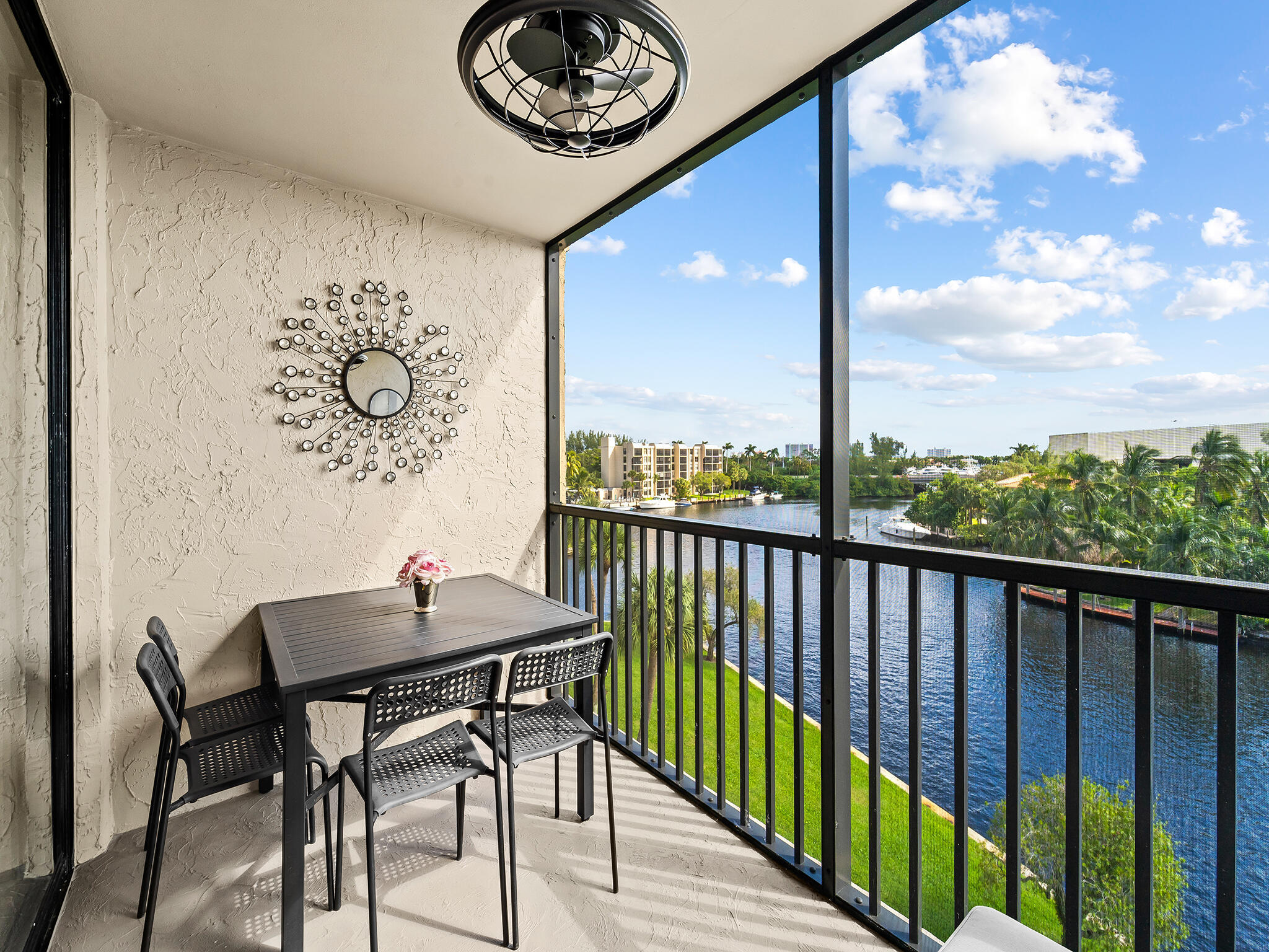13 Royal Palm Way, Unit 5030 Boca Raton, FL 33432 - Photo 2 of 15 a view of a balcony dining table and chairs
