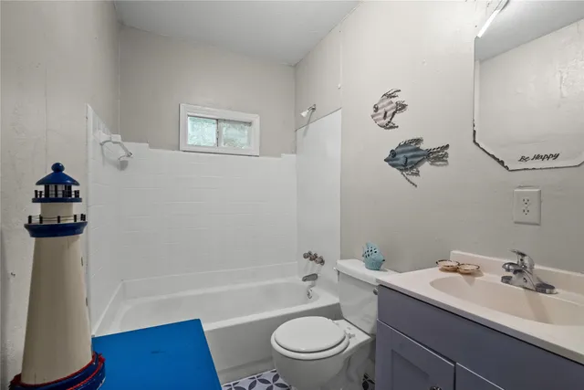 a bathroom with a sink a toilet and a bathtub