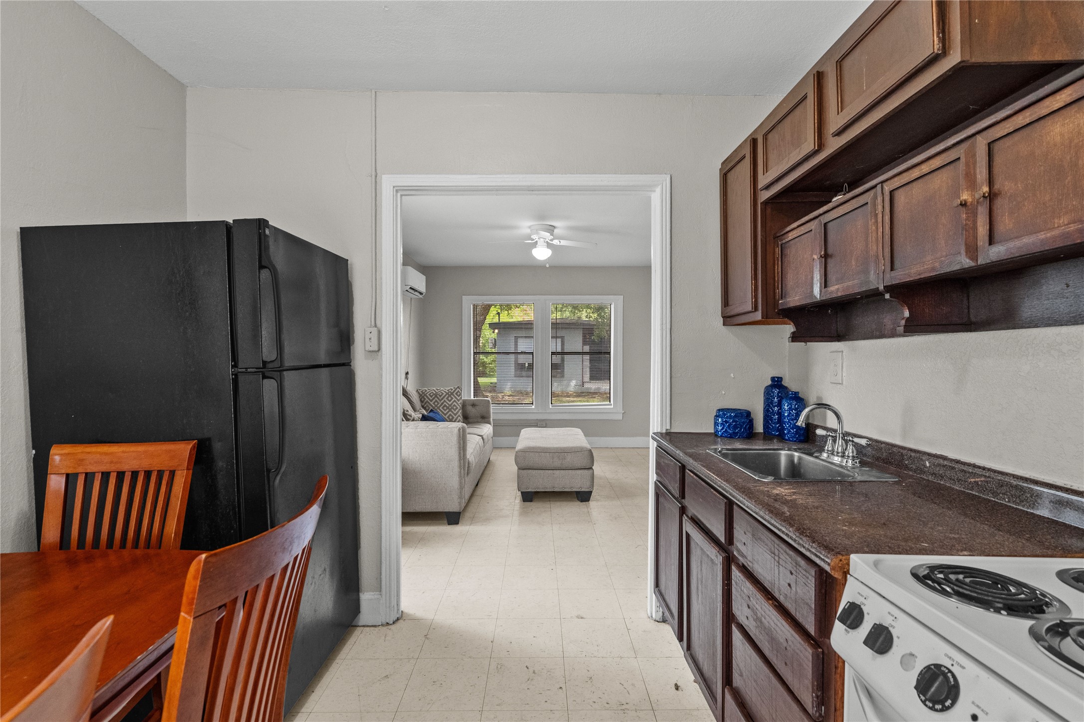 814 3rd Avenue North, Unit 46 Texas City, TX 77590 - Photo 6 of 11 a kitchen with stainless steel appliances granite countertop a refrigerator stove and sink