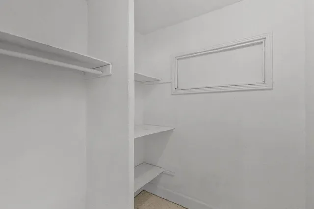 a view of an empty walk in closet