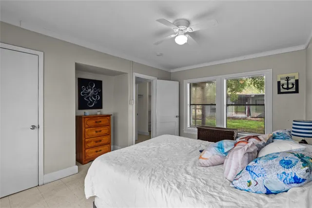 a bedroom with a bed dresser and a window