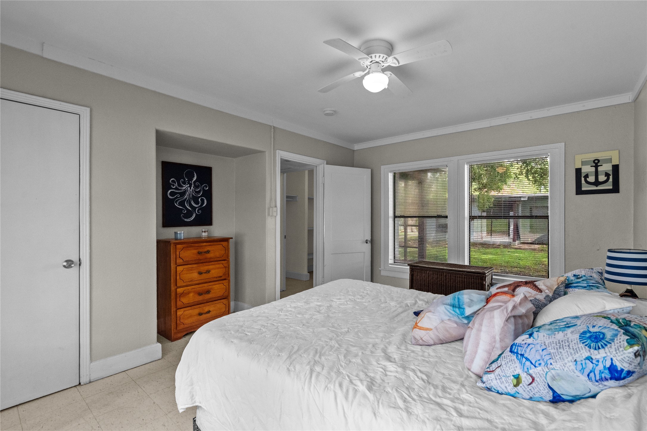 814 3rd Avenue North, Unit 46 Texas City, TX 77590 - Photo 9 of 11 a bedroom with a bed dresser and a window