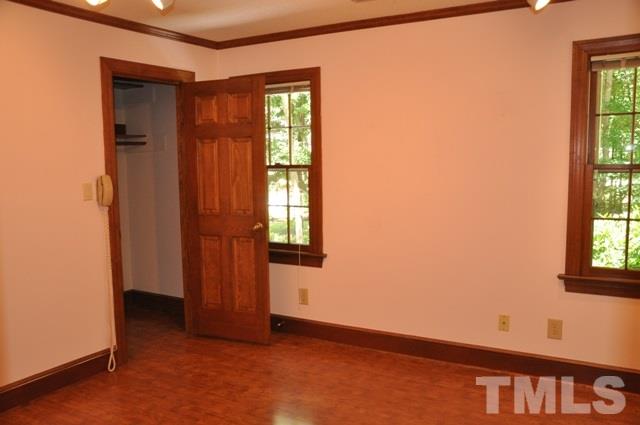 708 Sandown Place Raleigh, NC 27615 - Photo 18 of 25 a view of an empty room with a window