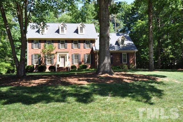 708 Sandown Place Raleigh, NC 27615 - Photo 25 of 25 a view of a white house with a big yard and large tree