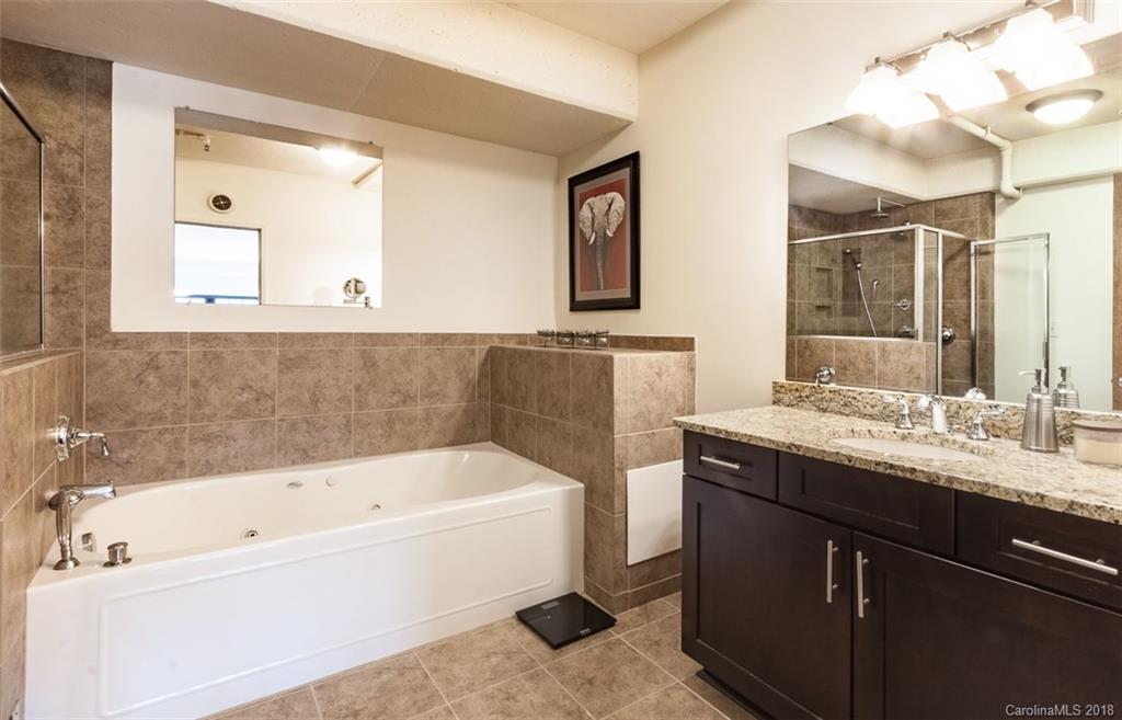 715 North Graham Street, Unit 604 Charlotte, NC 28202 - Photo 13 of 21 a bathroom with a bathtub and a sink