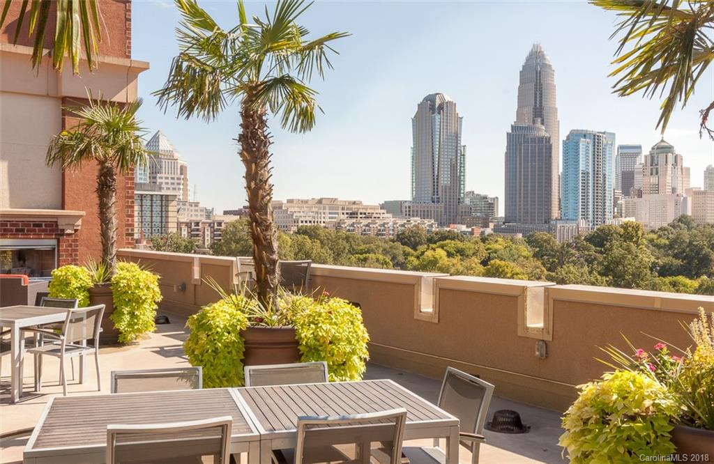 715 North Graham Street, Unit 604 Charlotte, NC 28202 - Photo 19 of 21 a view of a patio with couches table and chairs and potted plants