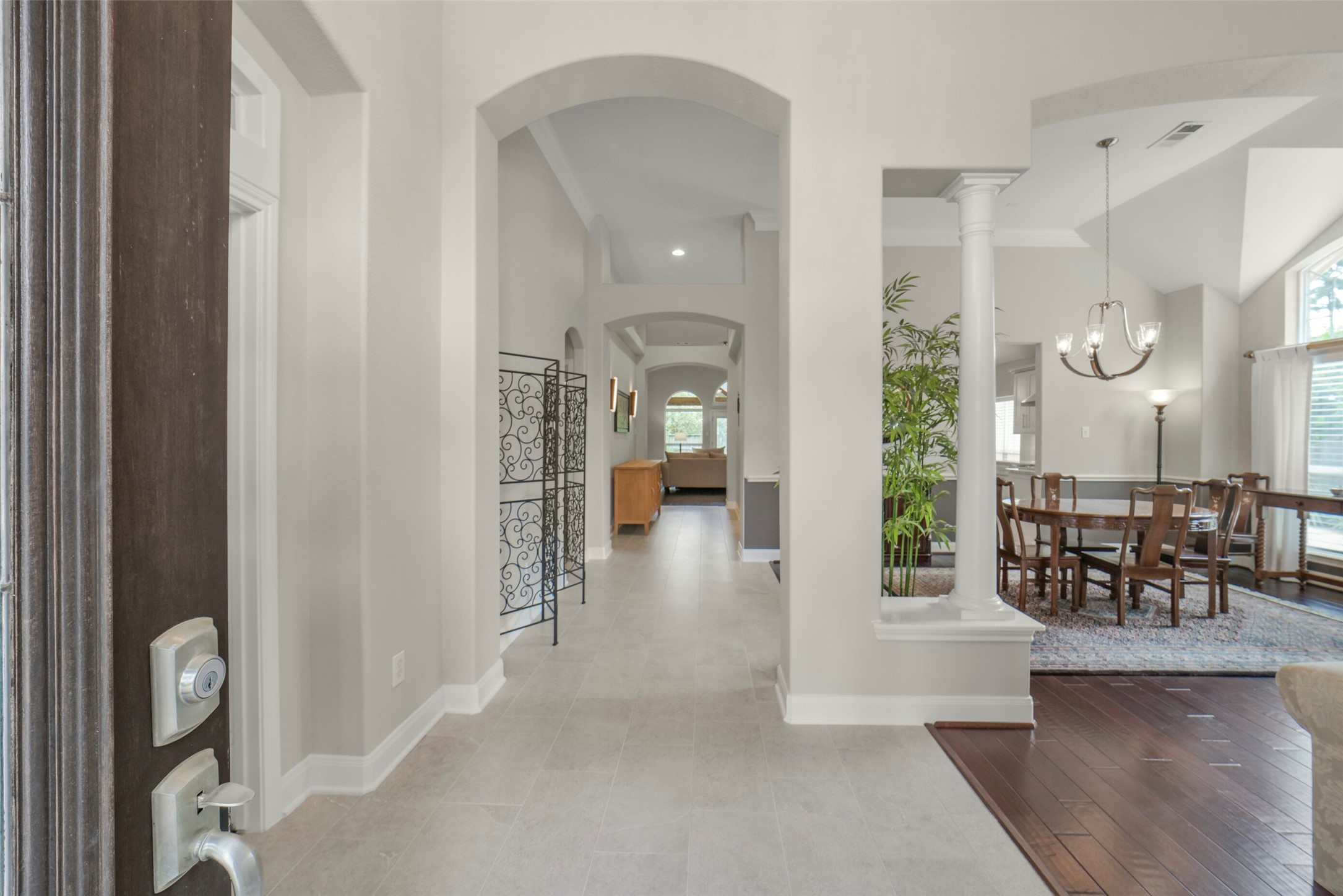 1310 Lambourne Circle Spring, TX 77379 - Photo 6 of 50 A welcoming entry with tall ceilings and open design. Foyer and and hall with LED ceiling lights. New tile in entry, hall, powder room and kitchen