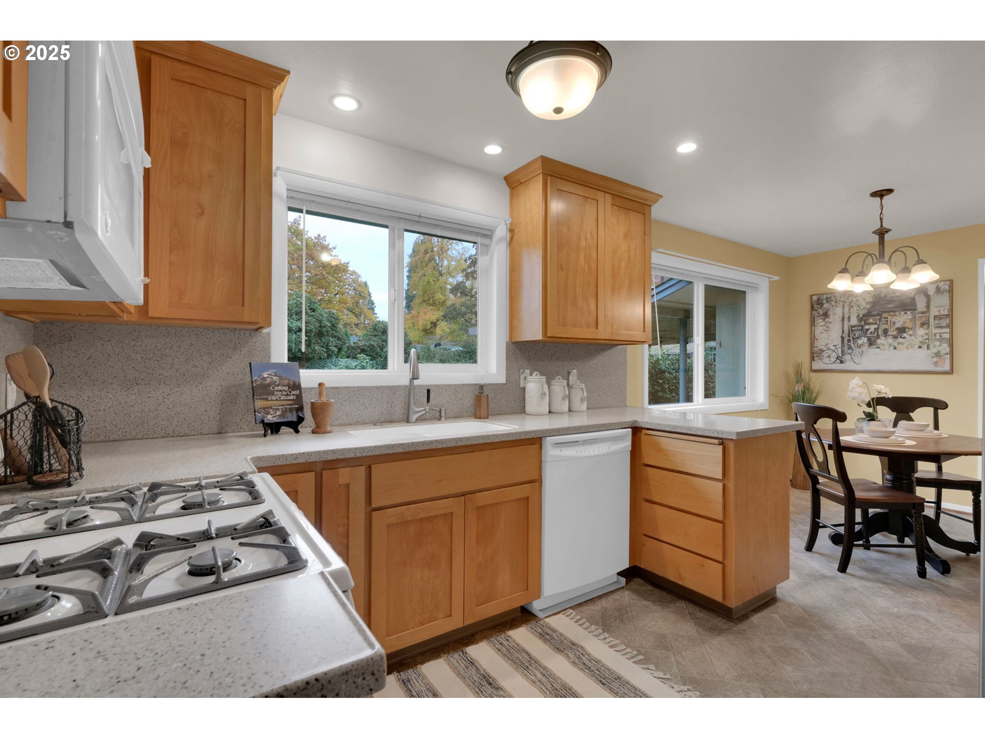 240 Dibblee Lane Eugene, OR 97404 - Photo 12 of 42 a kitchen with a stove a sink and a refrigerator