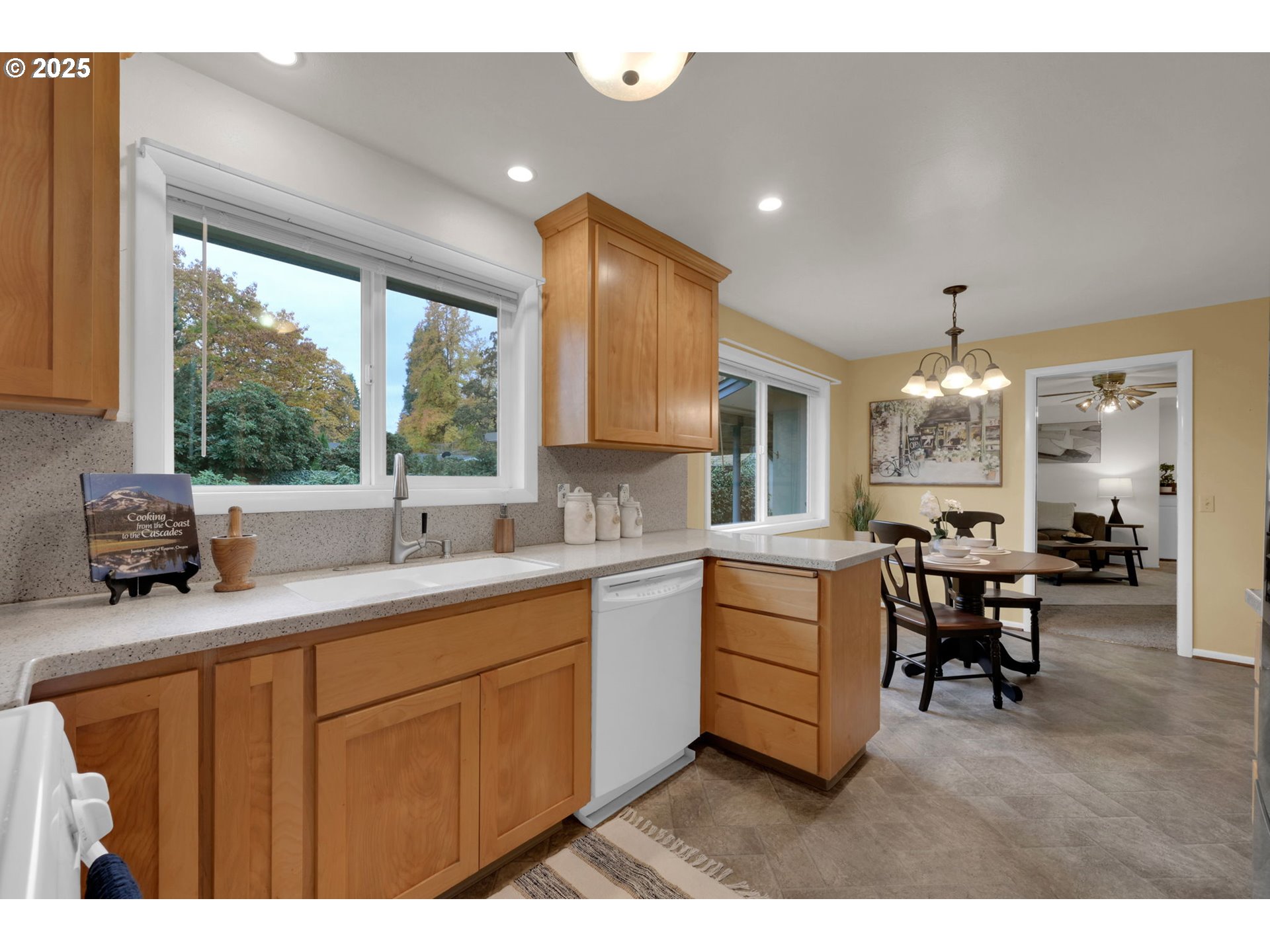 240 Dibblee Lane Eugene, OR 97404 - Photo 13 of 42 a kitchen with sink cabinets and dining table