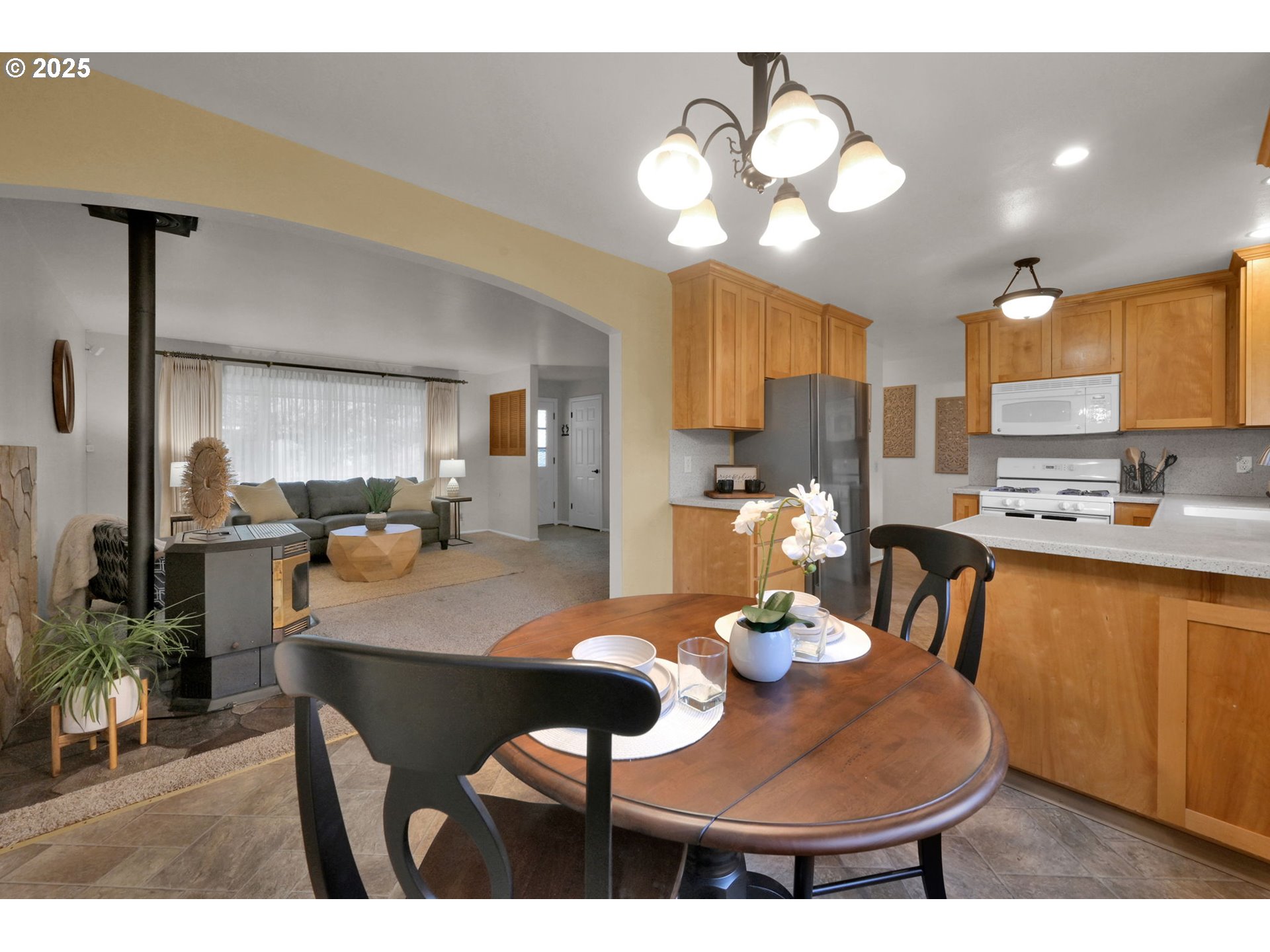 240 Dibblee Lane Eugene, OR 97404 - Photo 14 of 42 a kitchen with dining table and chairs