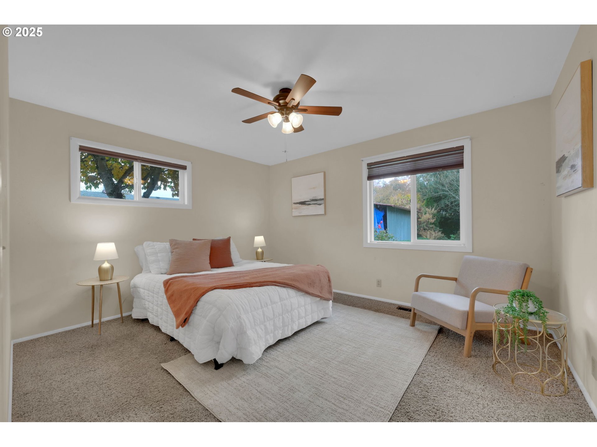 240 Dibblee Lane Eugene, OR 97404 - Photo 23 of 42 a bedroom with a bed and a chandelier