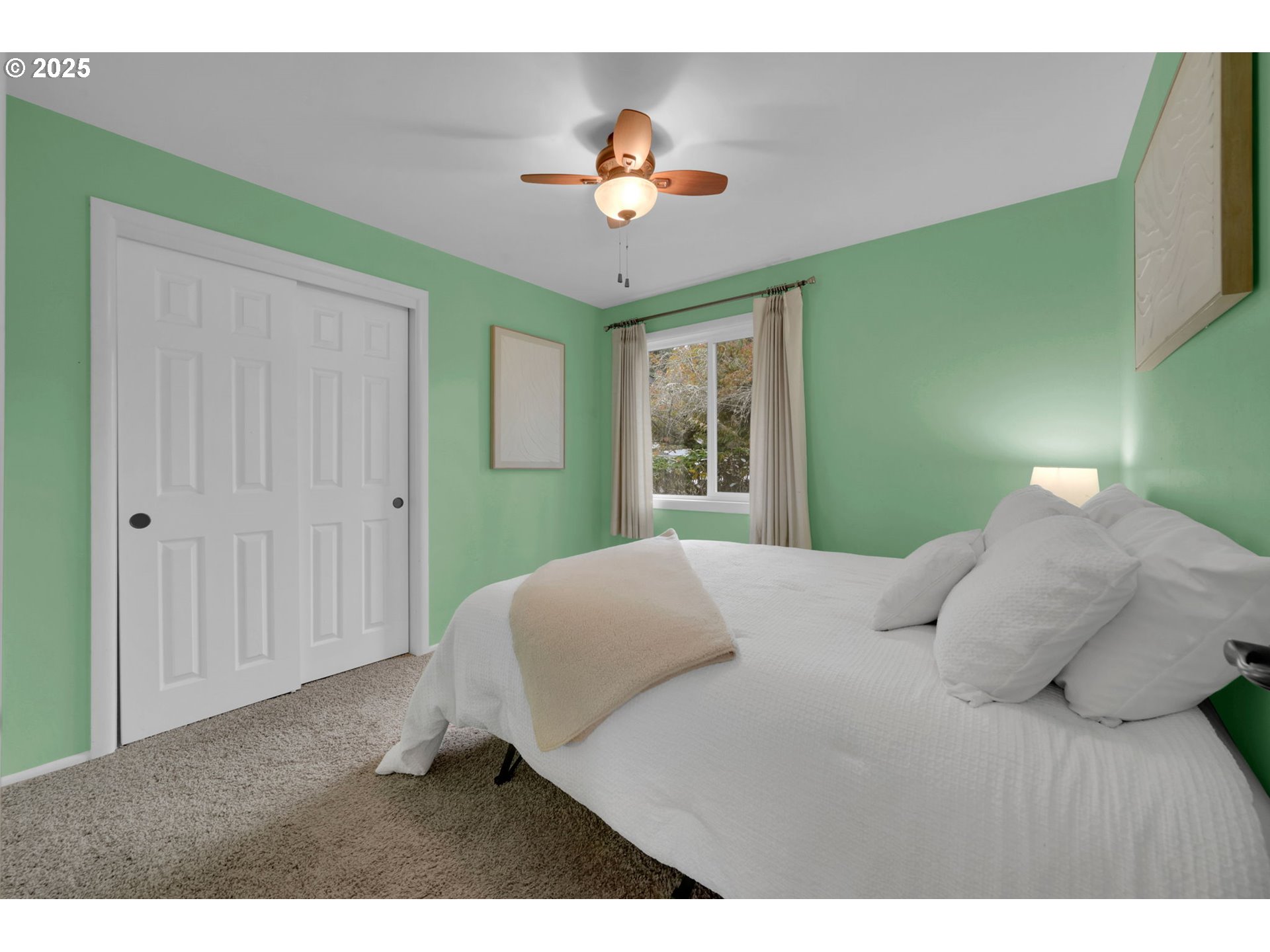 240 Dibblee Lane Eugene, OR 97404 - Photo 26 of 42 a bedroom with a bed and a chandelier