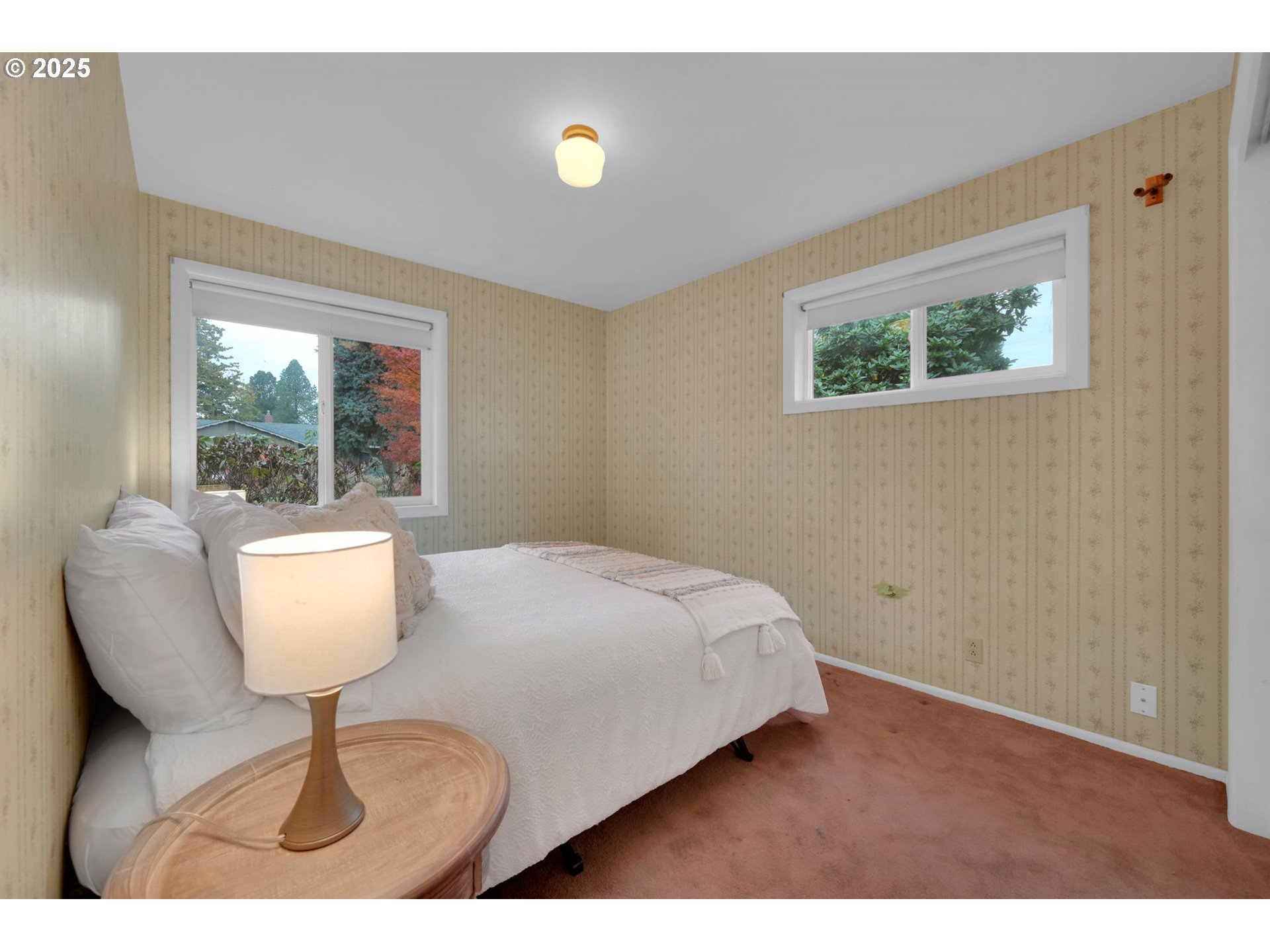 240 Dibblee Lane Eugene, OR 97404 - Photo 27 of 42 a bedroom with a bed and a chair