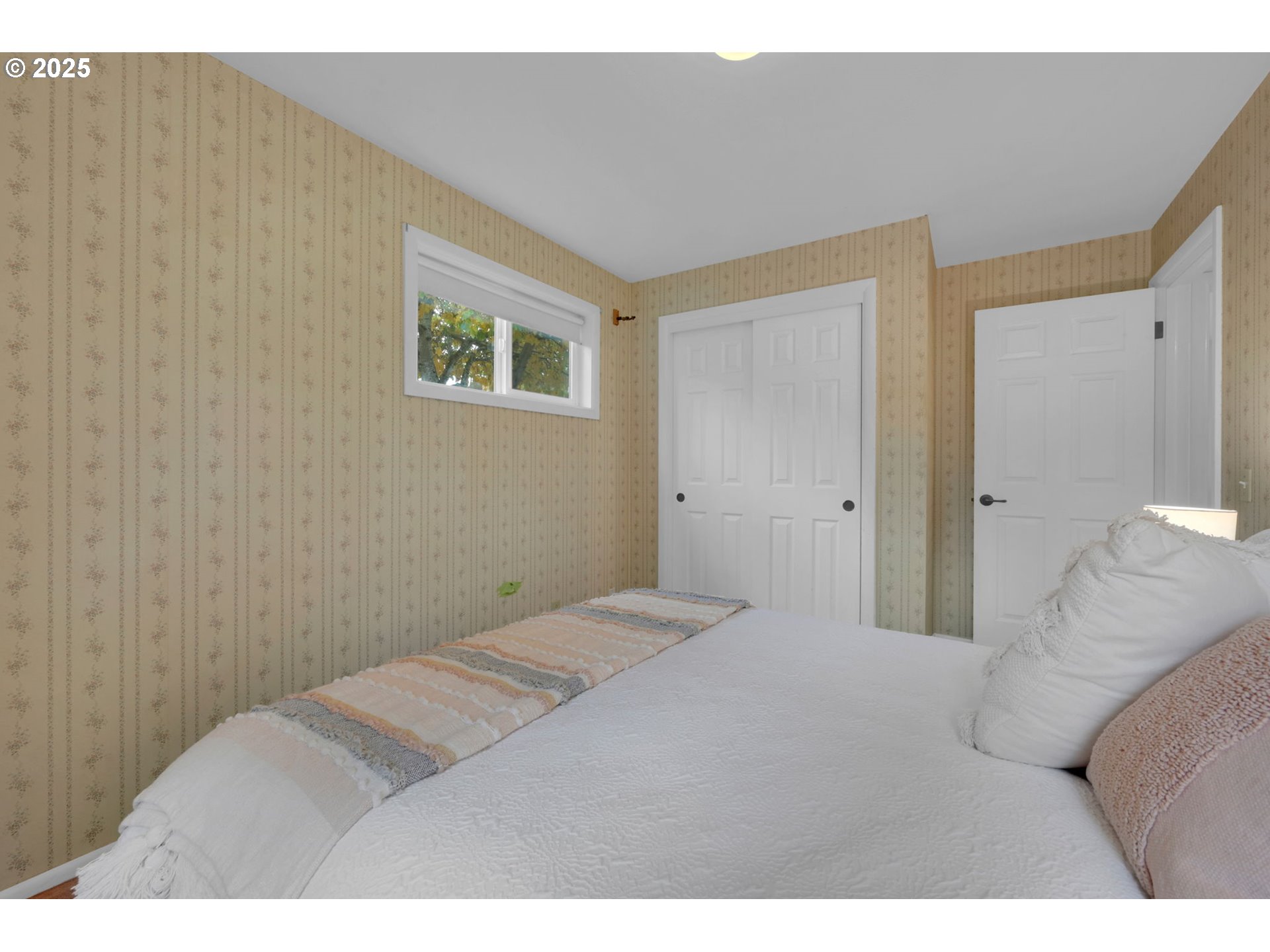 240 Dibblee Lane Eugene, OR 97404 - Photo 28 of 42 a bedroom with a bed and a couch